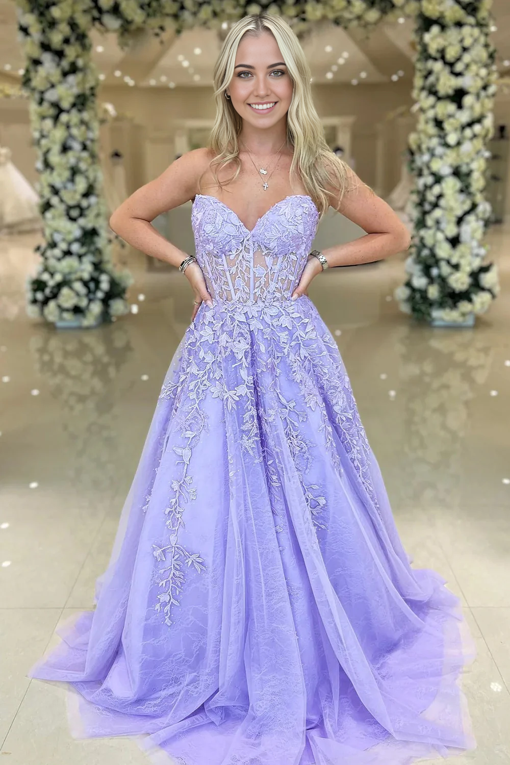 Elegant A-Line Sweetheart Purple Corset Prom Dress with intricate appliques.