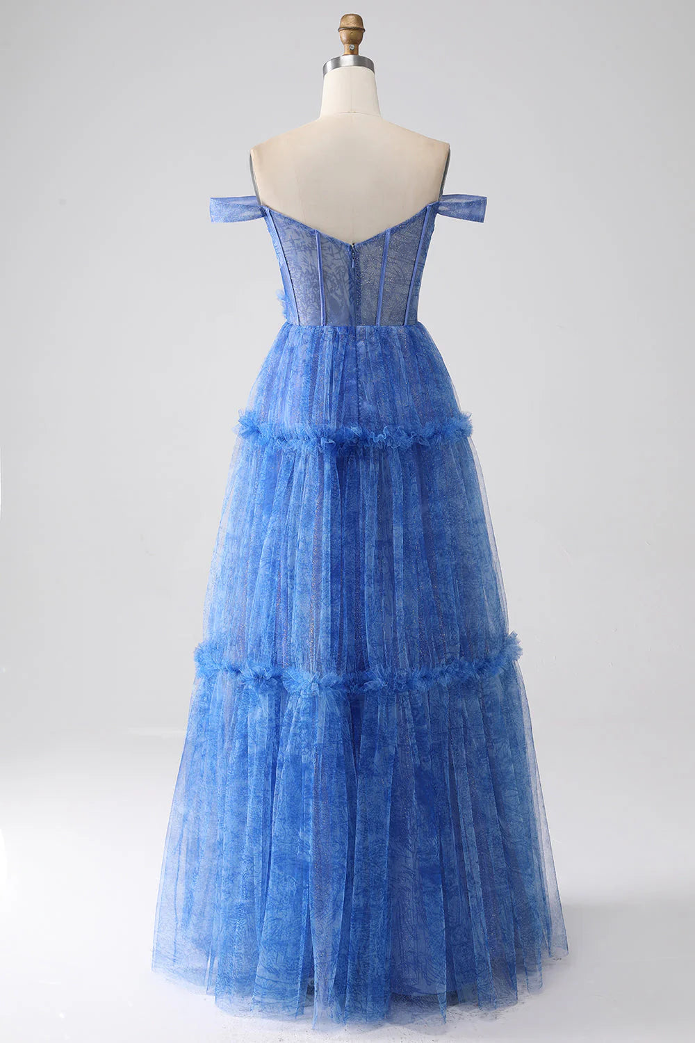 Side view of a model in the blue A-line tulle corset prom dress.