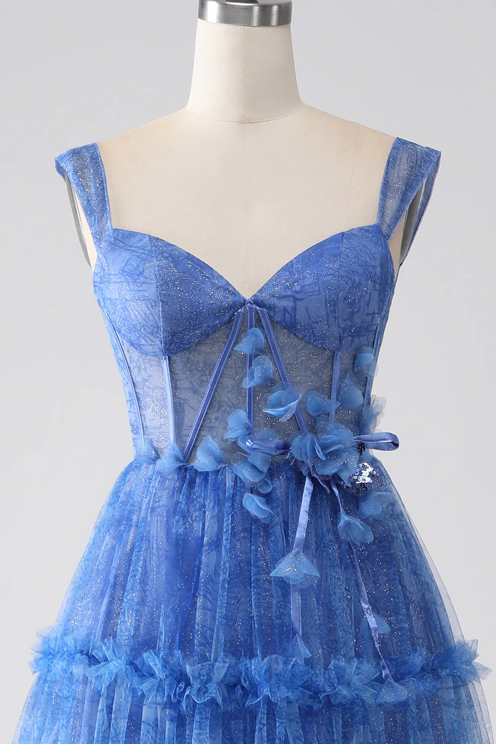 Close-up of the blue A-line tulle corset prom dress fabric and bodice detail.