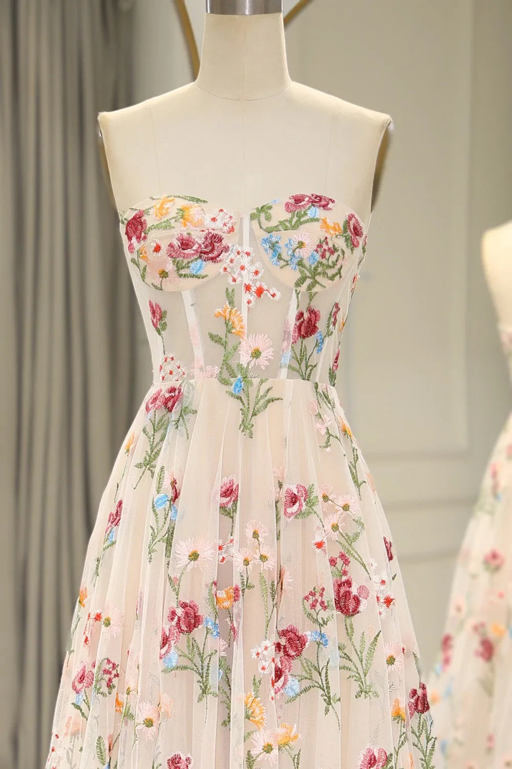 Side profile of a model wearing the long ivory A-line prom dress.