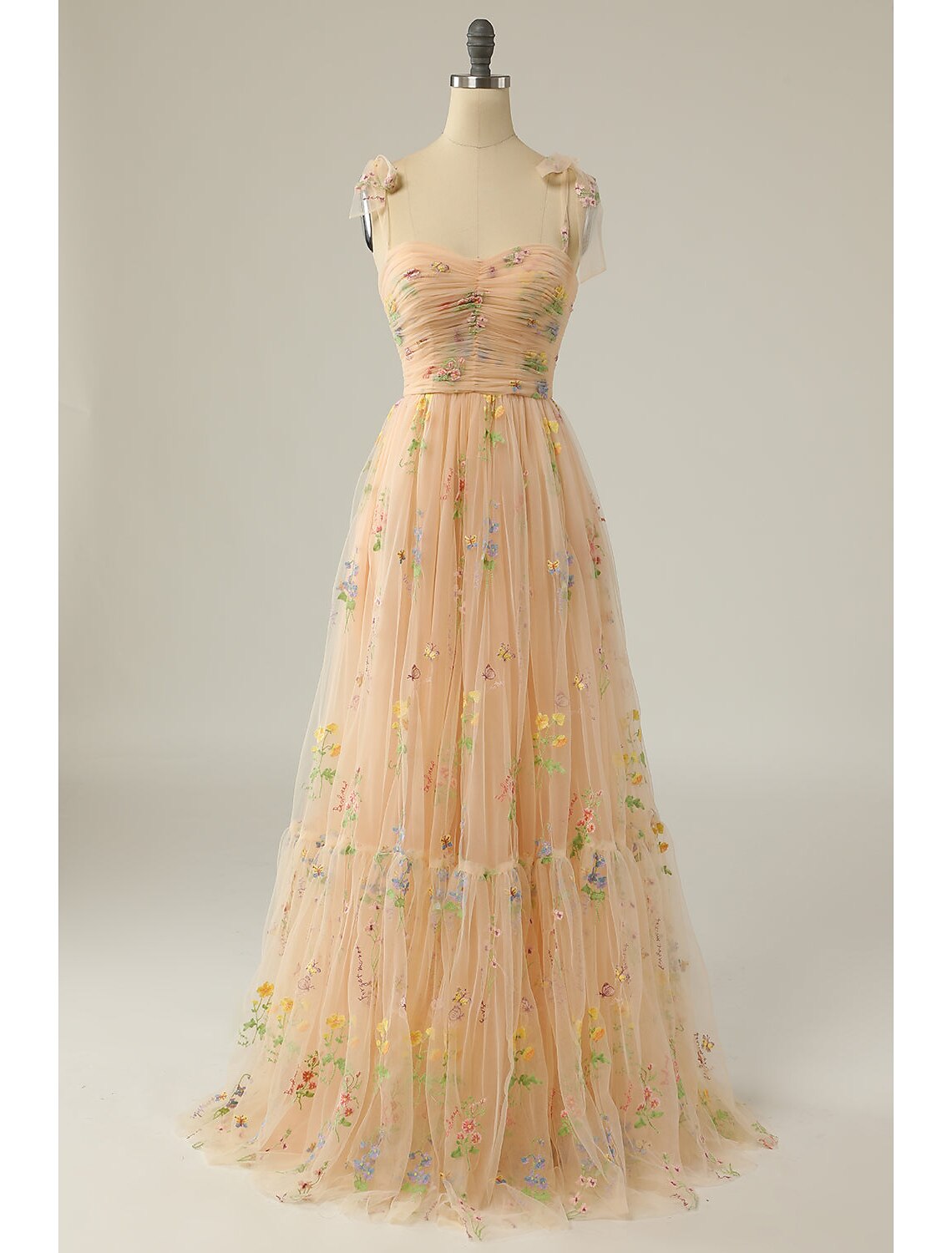 Back view of the sleeveless prom dress showing lace and open back.