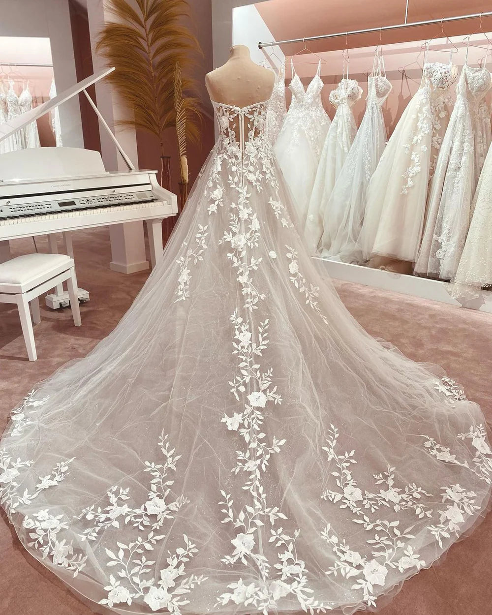 Romantic A-Line bridal gown with flowing tulle skirt.