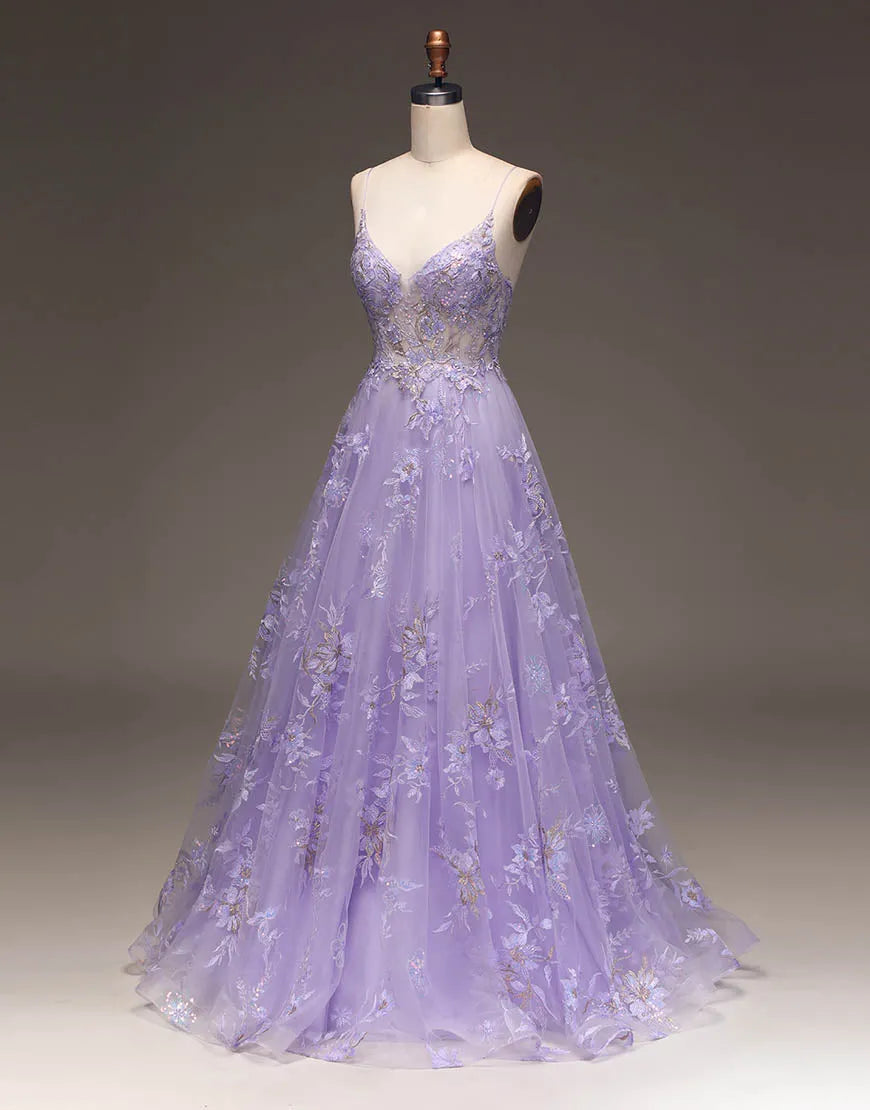 Close-up of delicate appliques on a long purple glitter dress.