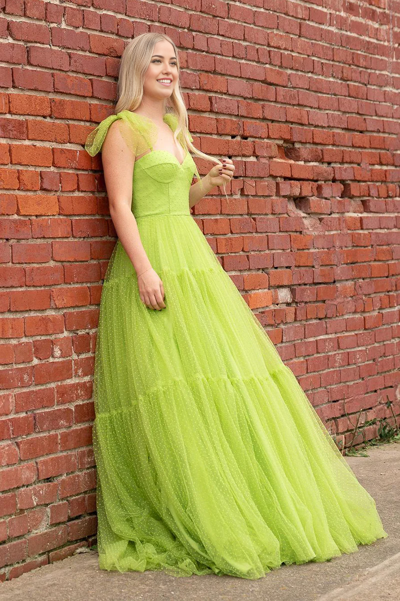 Full view of an elegant A-line sweetheart green dot tulle long prom gown.