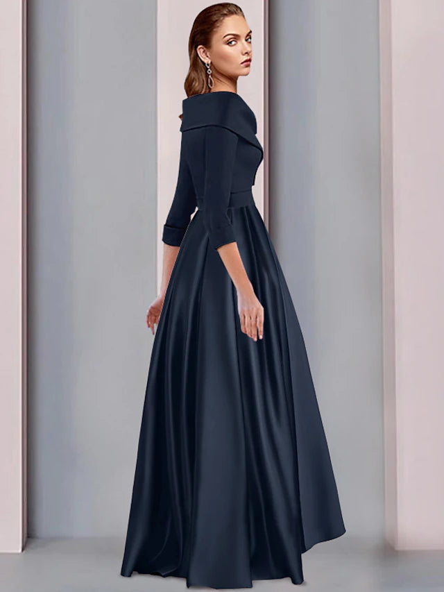 Close-up of the sweetheart neckline and pleated details on the satin A-line dress.