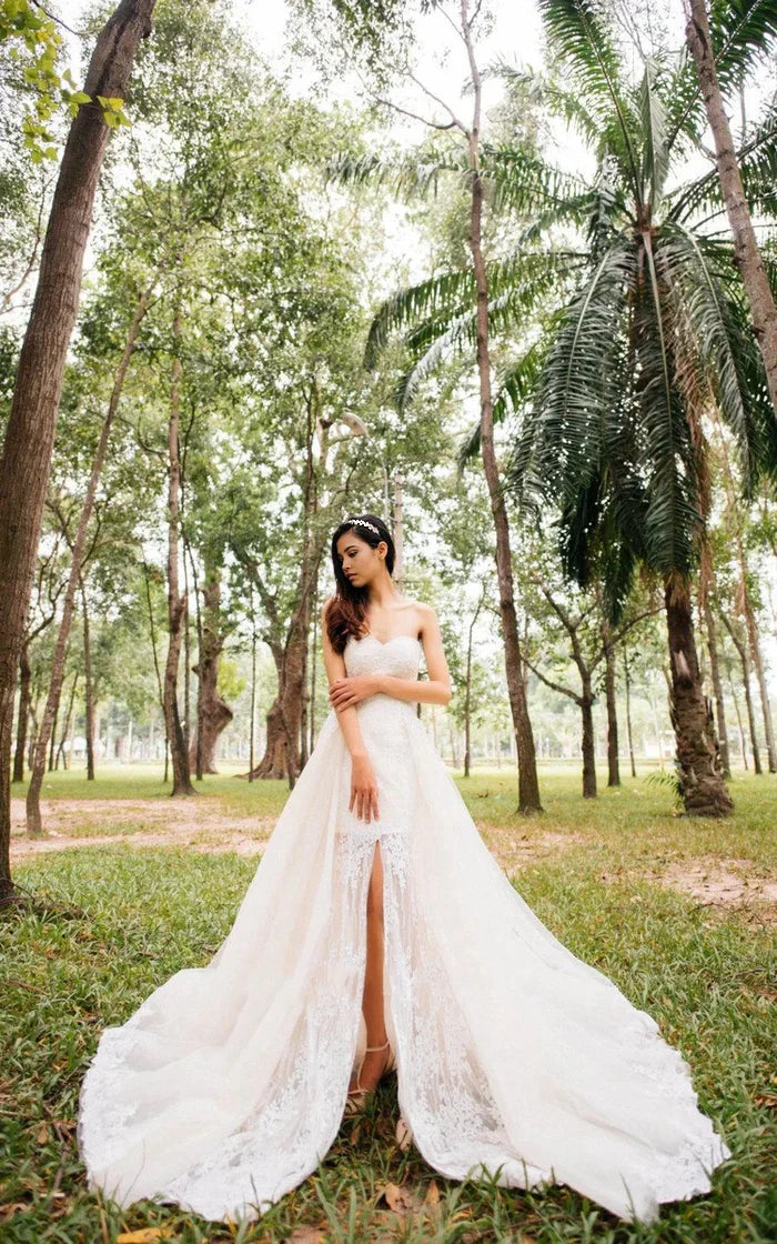 Elegant A-line wedding dress with sweetheart neckline and lace appliques.