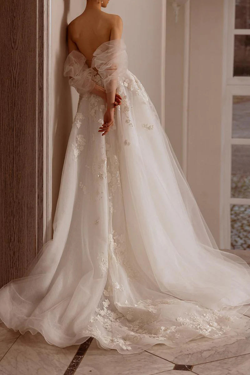 Side profile of the sleeveless A-Line bridal gown.