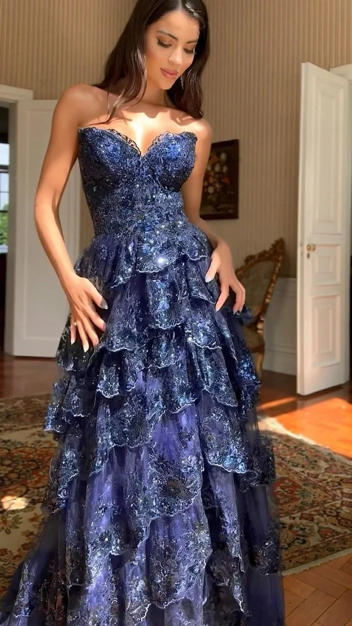 Elegant A-line dark navy blue prom dress with lace and sequin details.