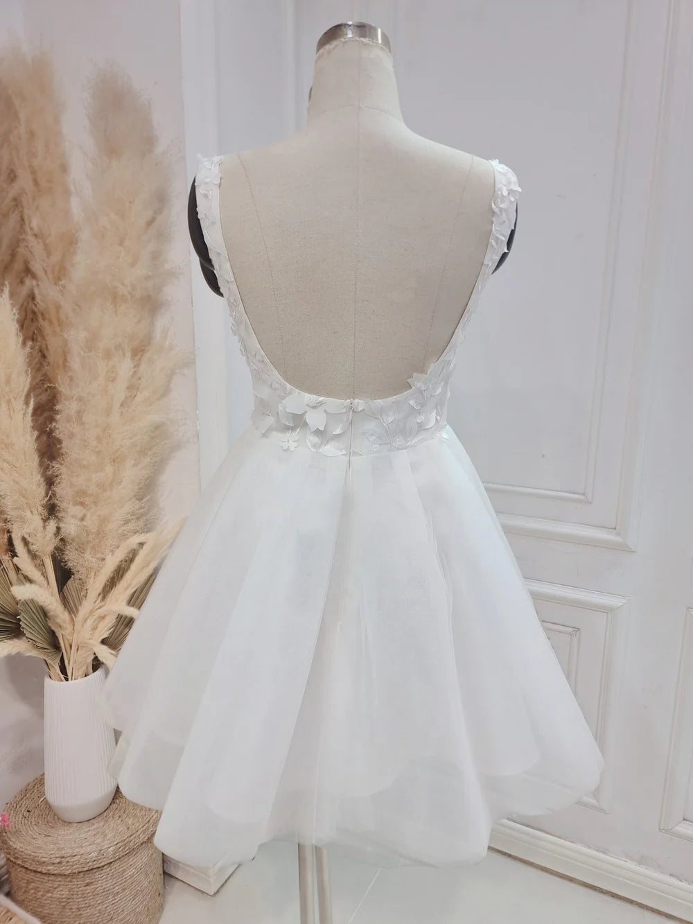 Side view of a beautiful A-line bridal gown with delicate lace details.