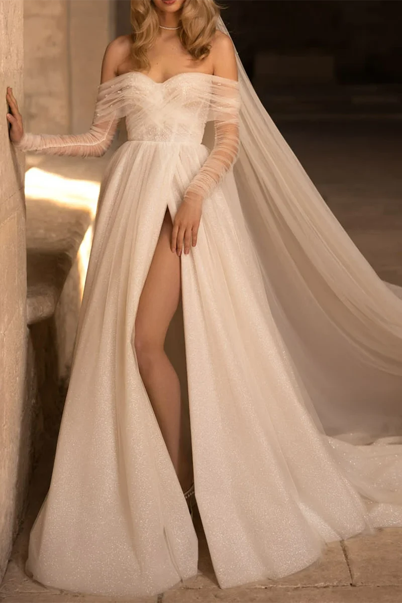 Elegant A-line wedding dress with sweetheart neckline and long sleeves.