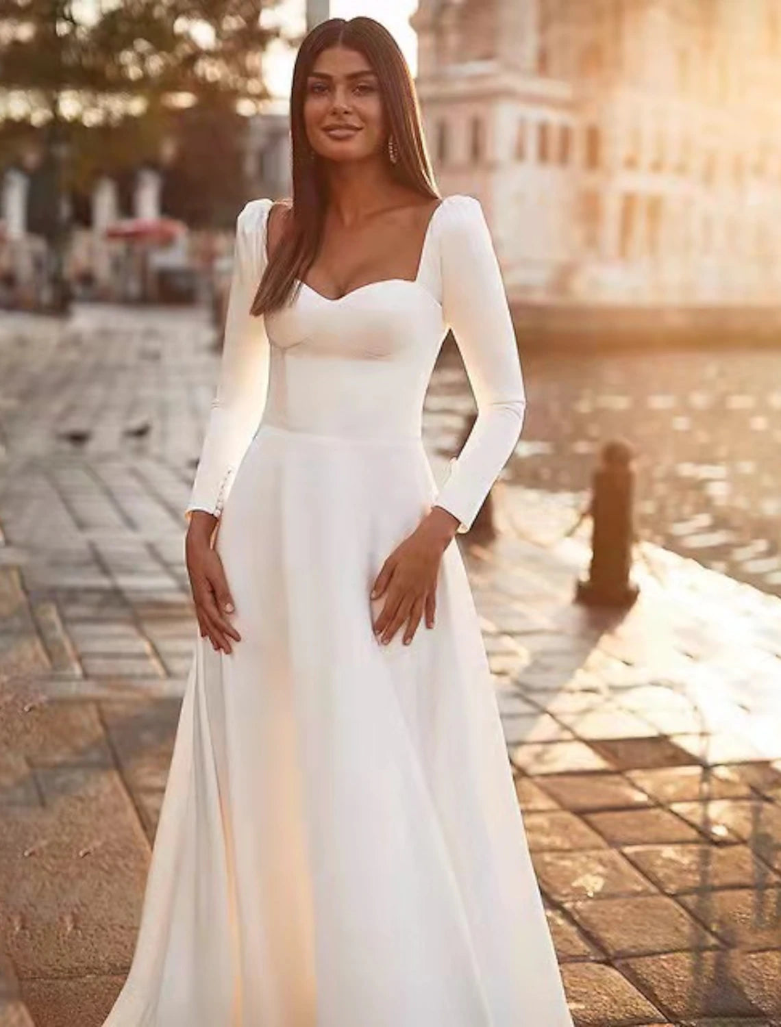 Back view of the bridal gown, showcasing the sweep train.