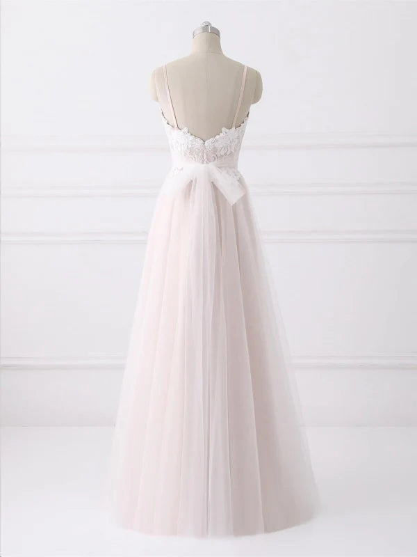 Woman wearing a backless A-line lace maxi dress for a formal event.