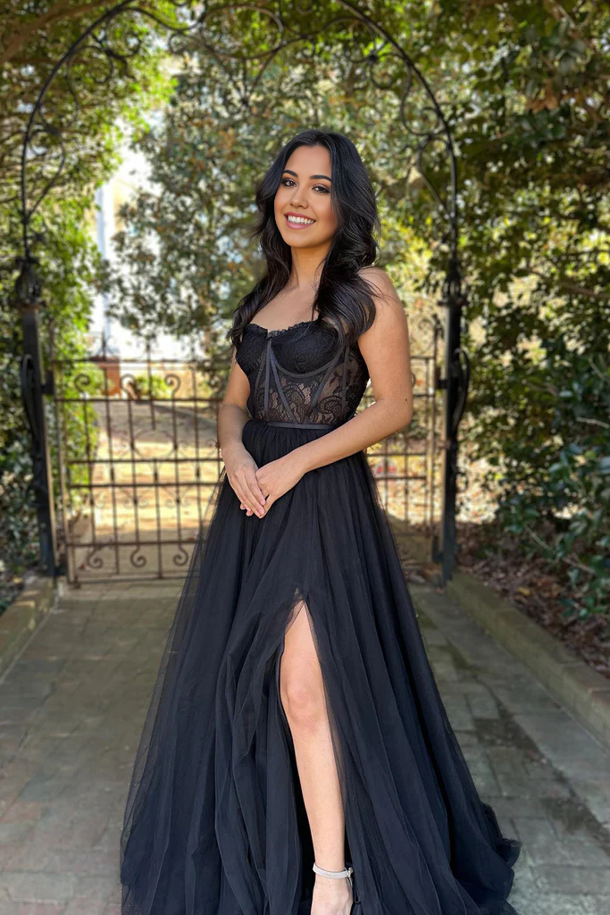Elegant black A-line prom dress with sweetheart neckline and lace details.