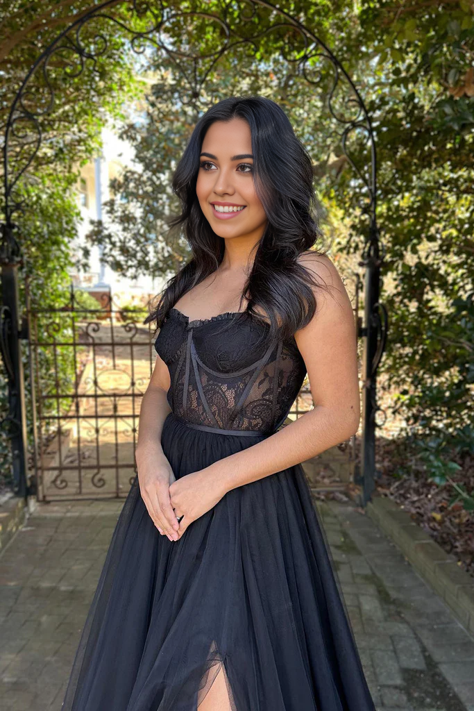 Close-up of the sweetheart neckline and lace bodice on a black formal dress.