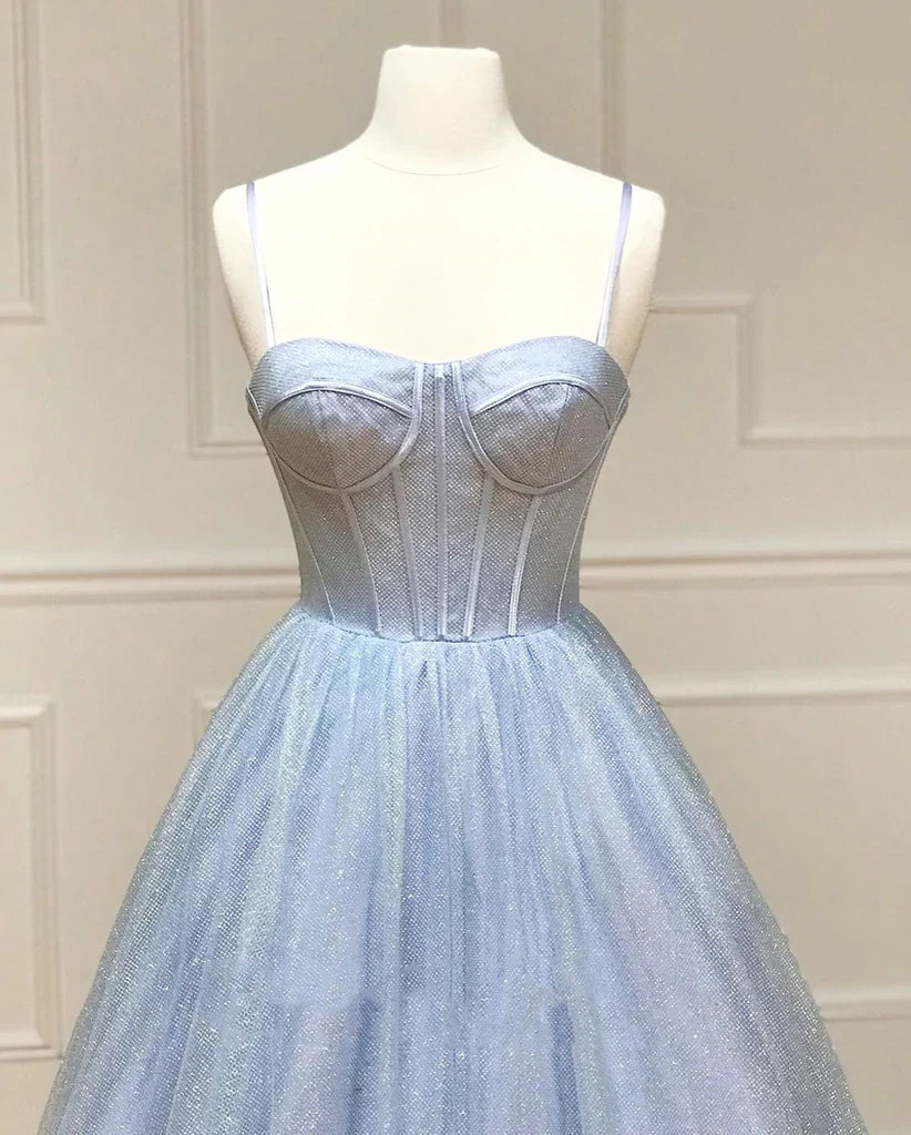 Woman posing in a sophisticated A-line sweetheart neck prom dress.
