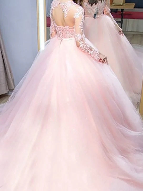 Back view of a lace long prom dress.