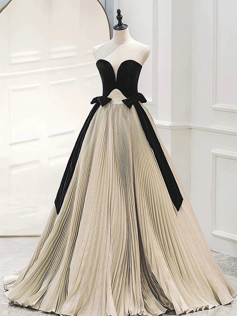 Model wearing an elegant A-line sweetheart neck long prom dress in satin and velvet.