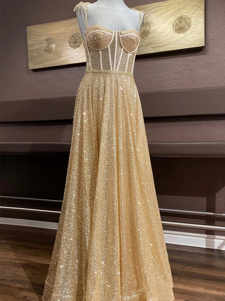 Model wearing an elegant A-line sweetheart neck spaghetti strap prom dress.