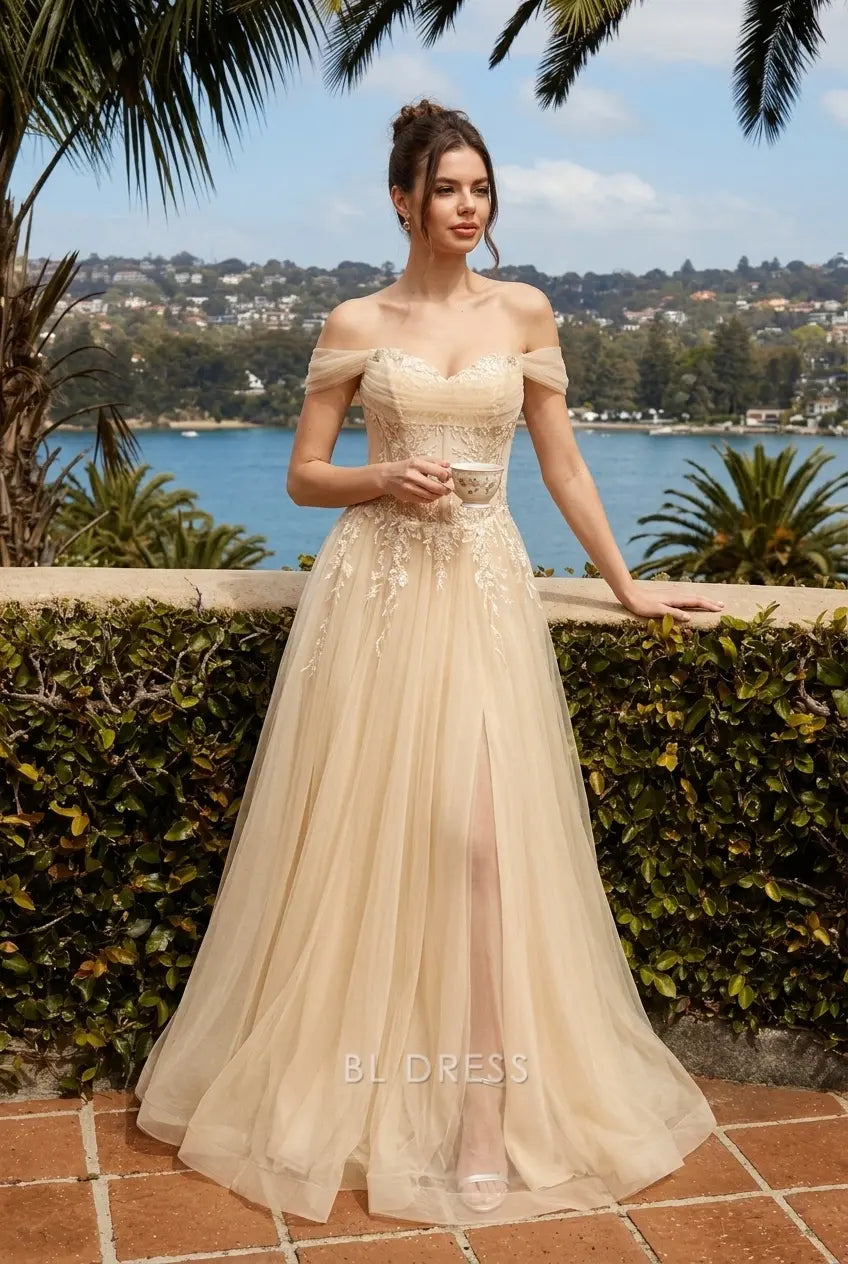 Back view of champagne prom dress, featuring adjustable lace-up closure and flowing tulle skirt.