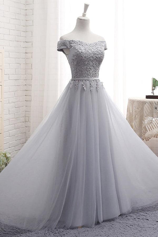 Close-up of the sweetheart neckline and off-shoulder design on the prom dress.