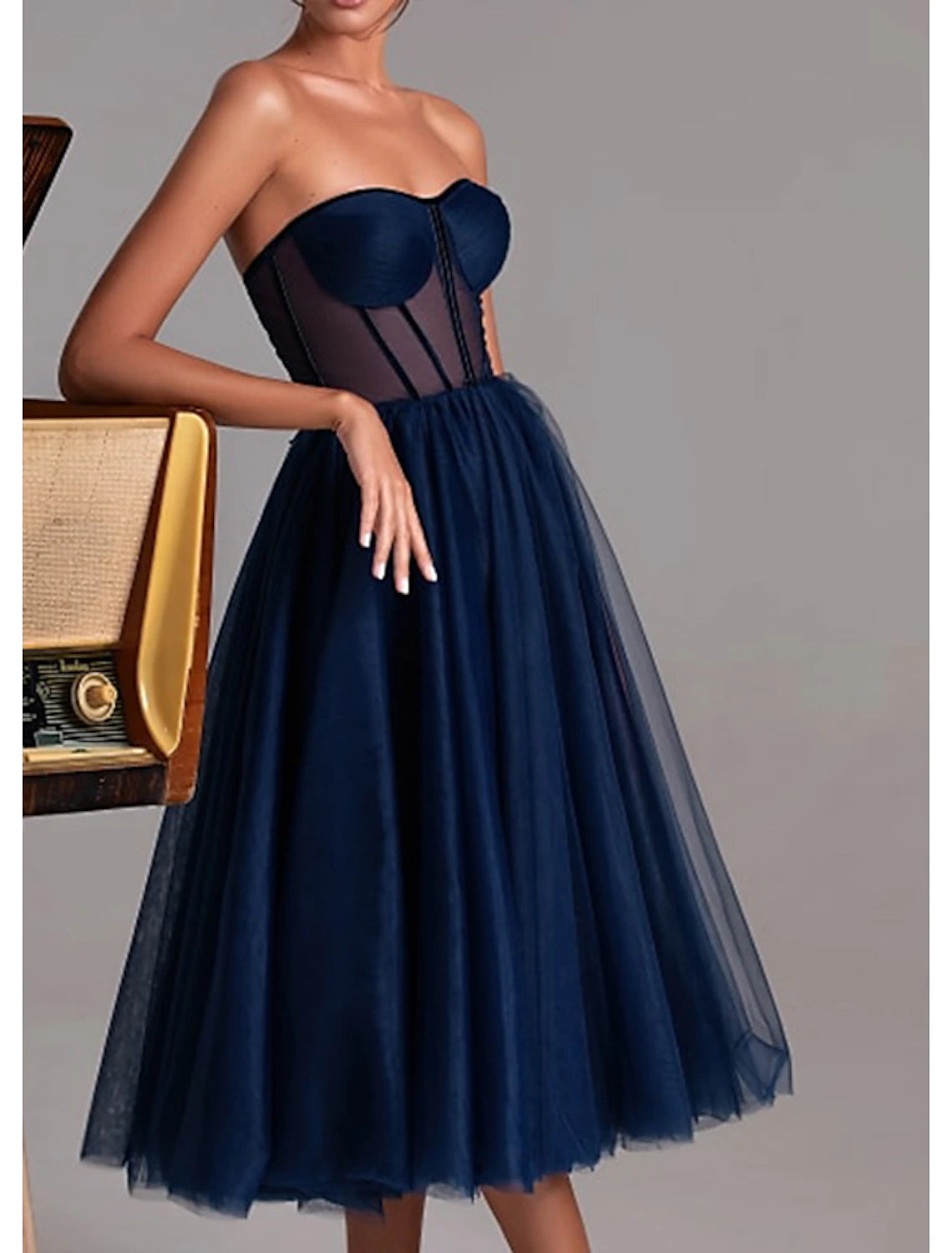 Model wearing the A-Line tea length cocktail dress, perfect for parties and wedding guests.