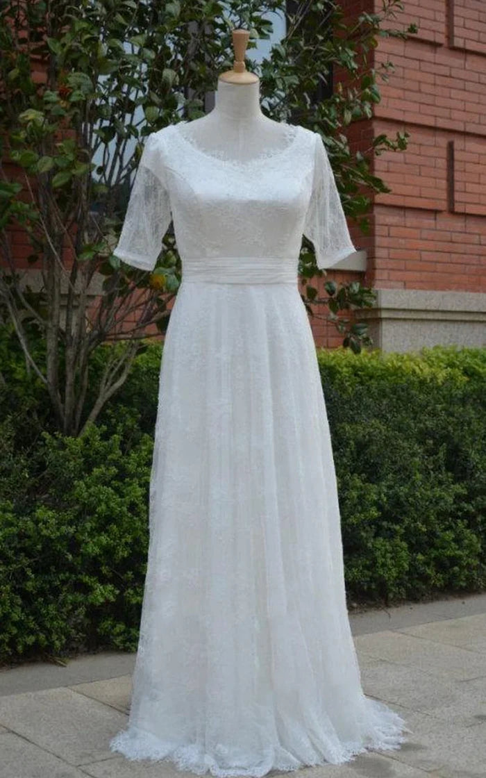 Elegant A-line wedding dress with tulle ruching and half illusion sleeves, front view.