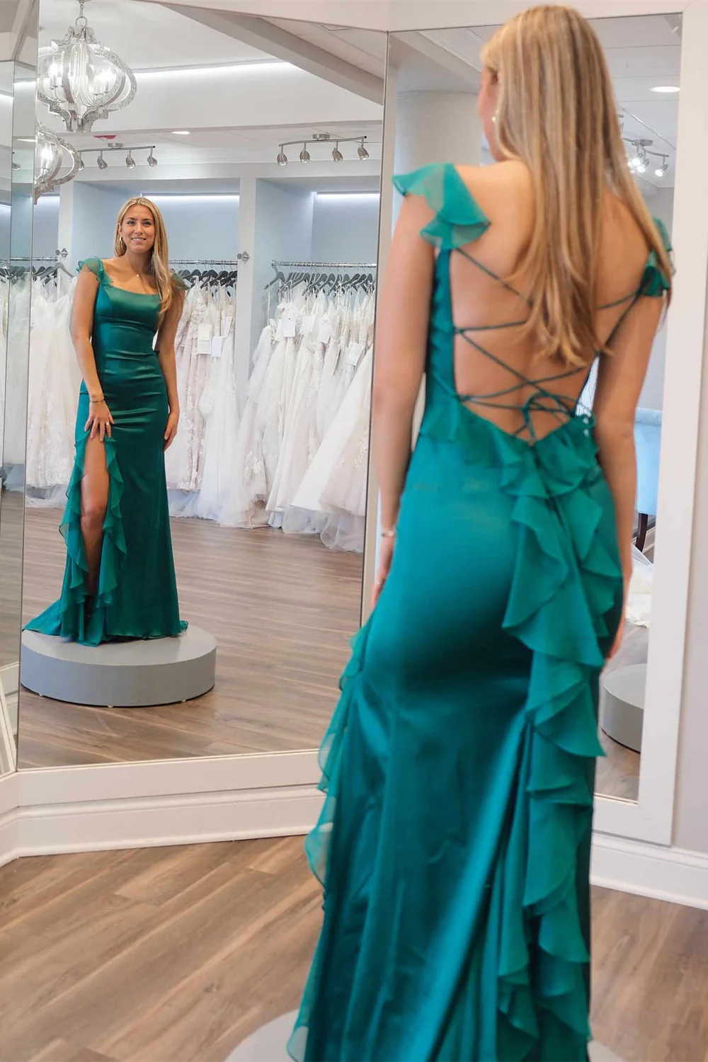 Close-up of the ruffle and slit detail on the prom dress.