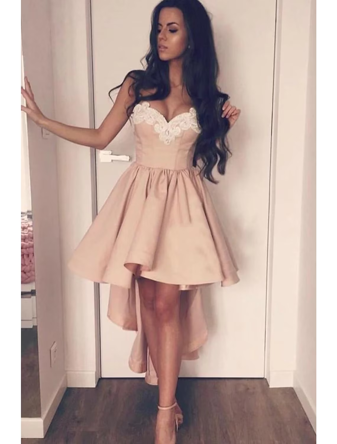 Full view of an A-line satin party dress with sweetheart neckline and asymmetrical hem.