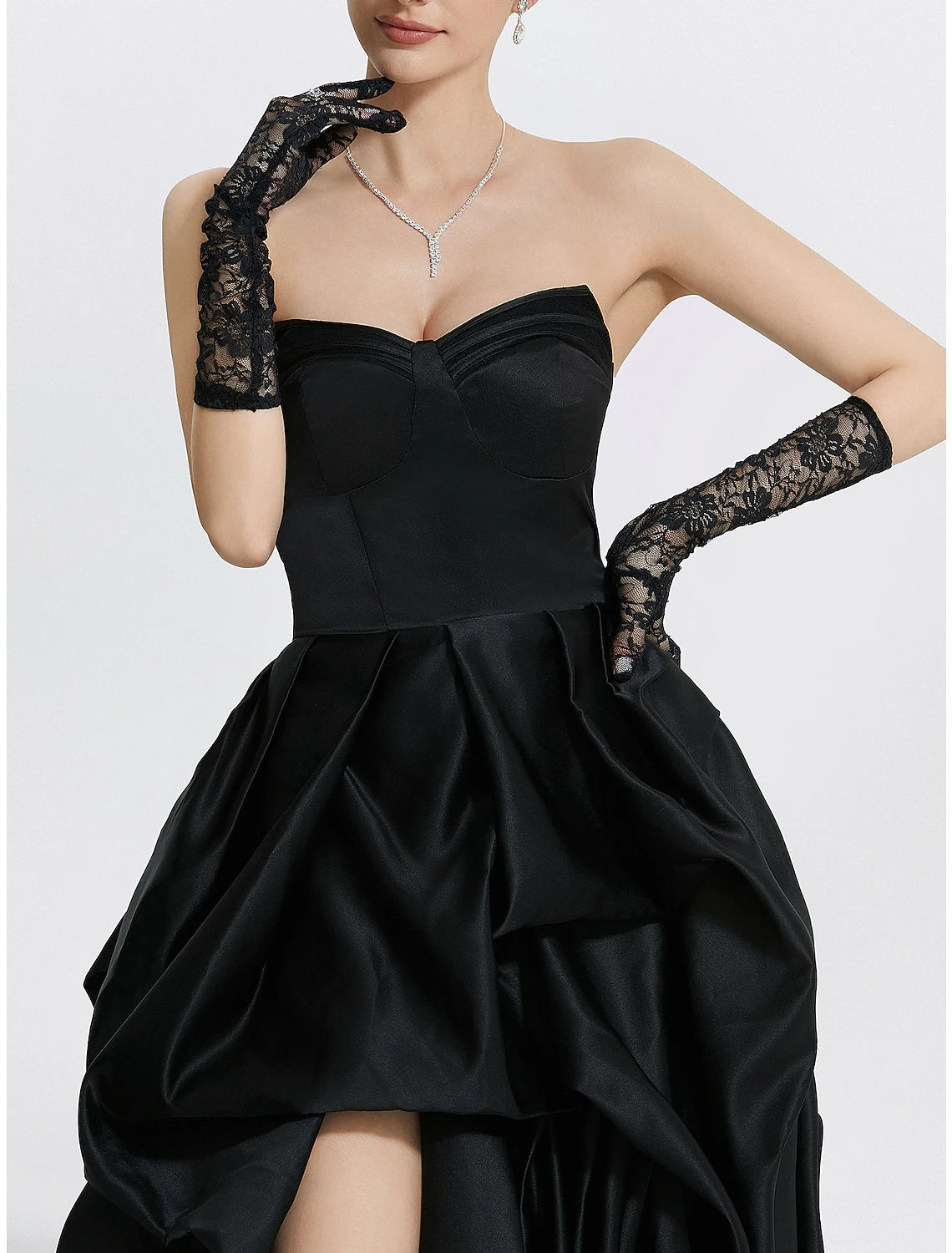 Full length view of the woman posing in the navy blue A-line formal dress.