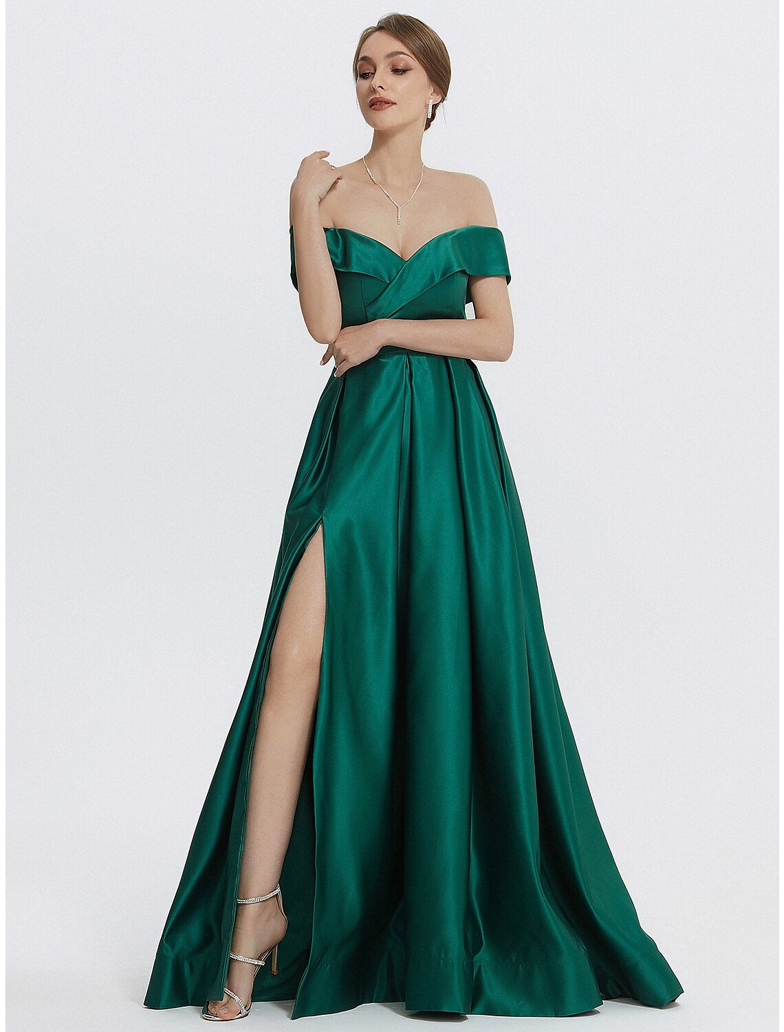 Close-up of the satin fabric and thigh-high slit on the gown.