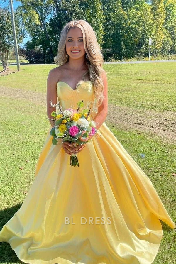 Yellow A-line satin formal dress with sweetheart neckline.