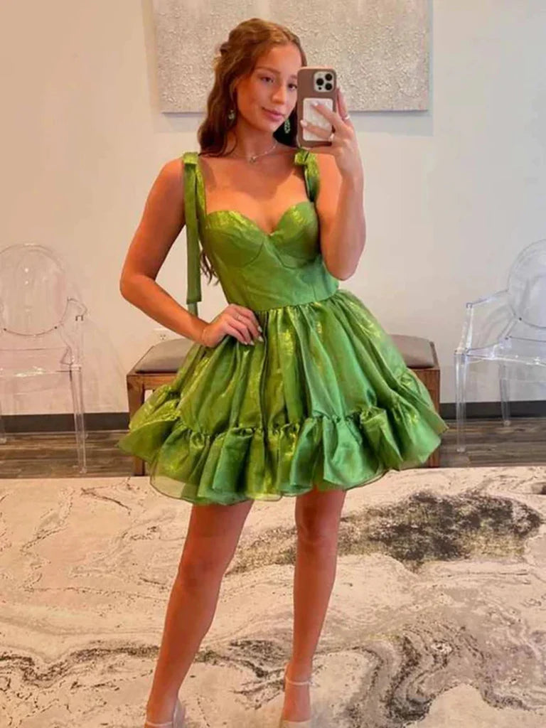 Model wearing an elegant short satin A-line dress with a sweetheart neckline.