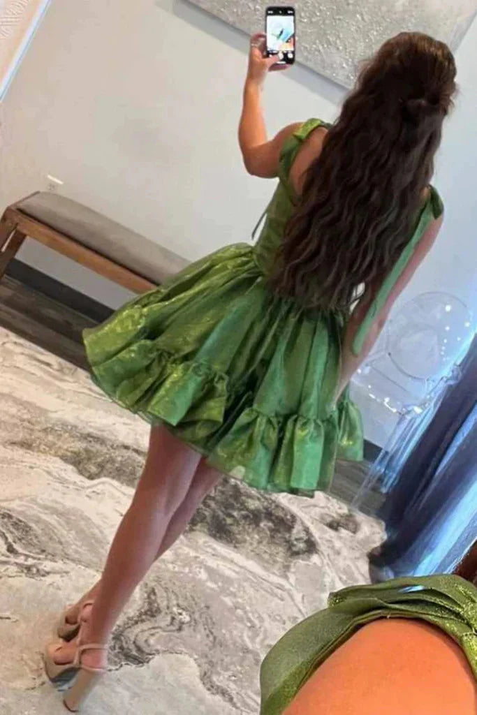 Side view of a short satin sweetheart neck dress, ideal for prom or homecoming.