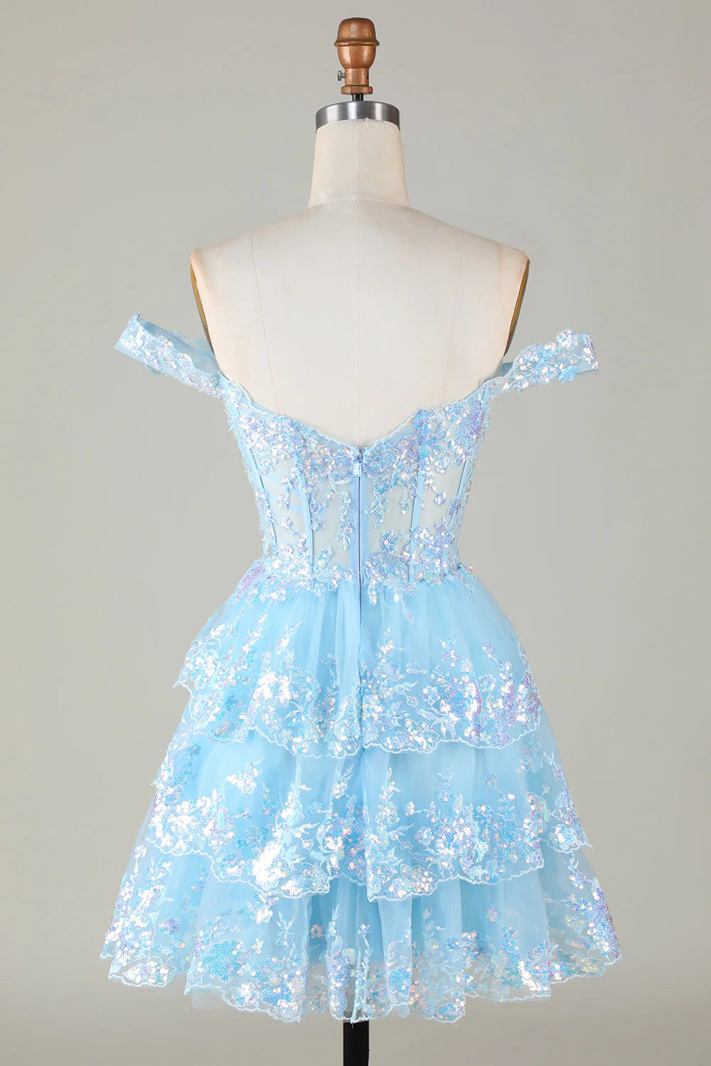 Back view of a short A-Line lace homecoming dress with sequin details.