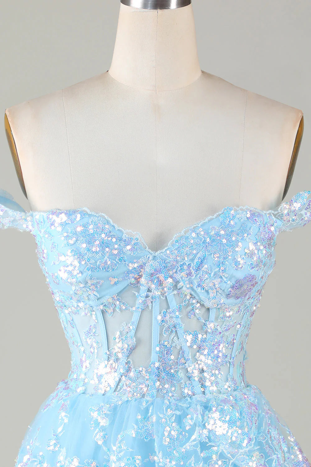Side view of an elegant short lace and sequin A-Line dress.