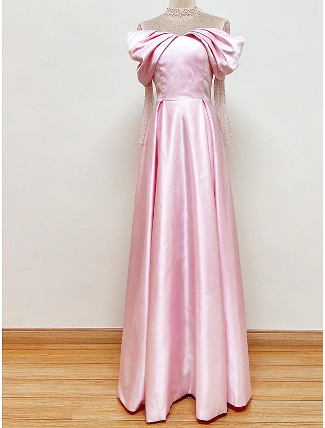 Elegant A-Line satin evening gown with sweetheart neckline and short sleeves.