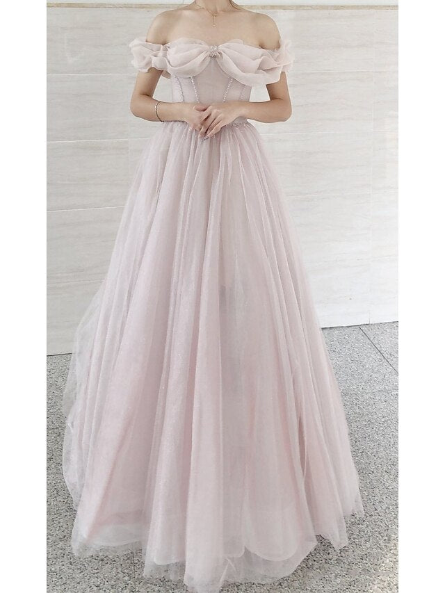 Full length view of the A-line prom dress, highlighting its silhouette and fabric.