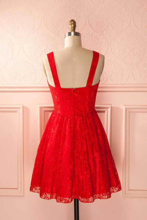 Close-up view of the intricate appliques on the sweetheart A-line homecoming dress.