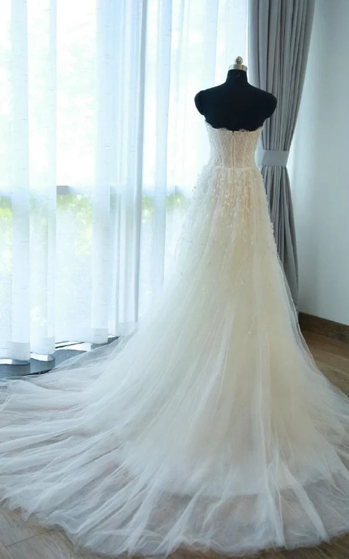 Back view of the A-line tea-length dress featuring a zipper and keyhole.