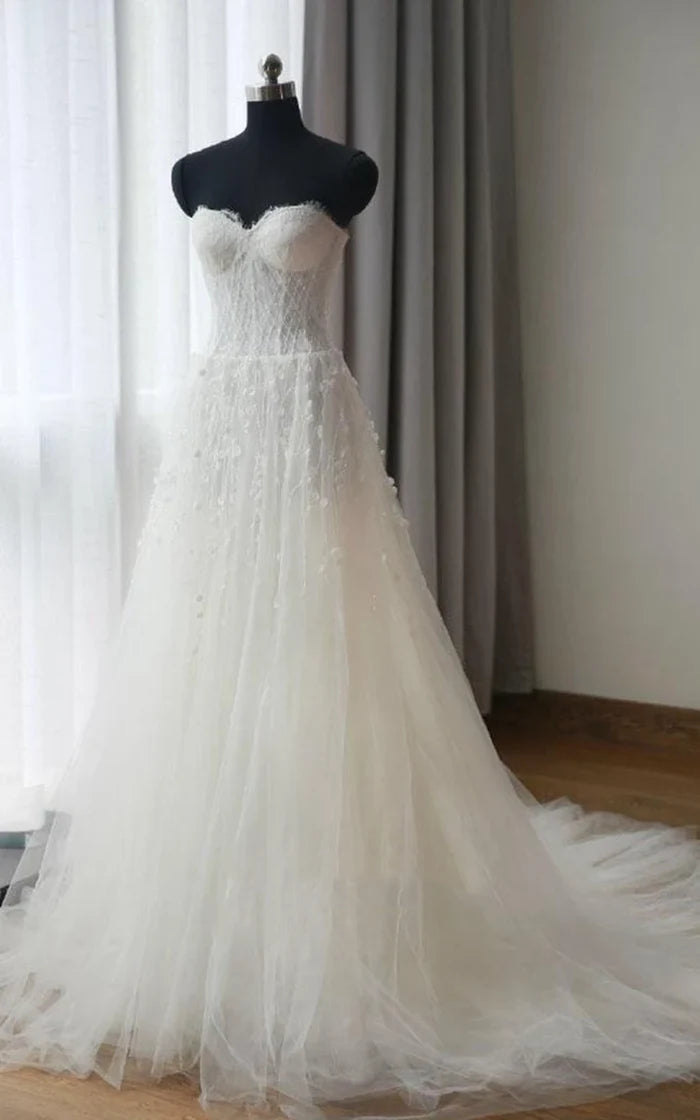 Side view of the graceful A-line tea-length dress.