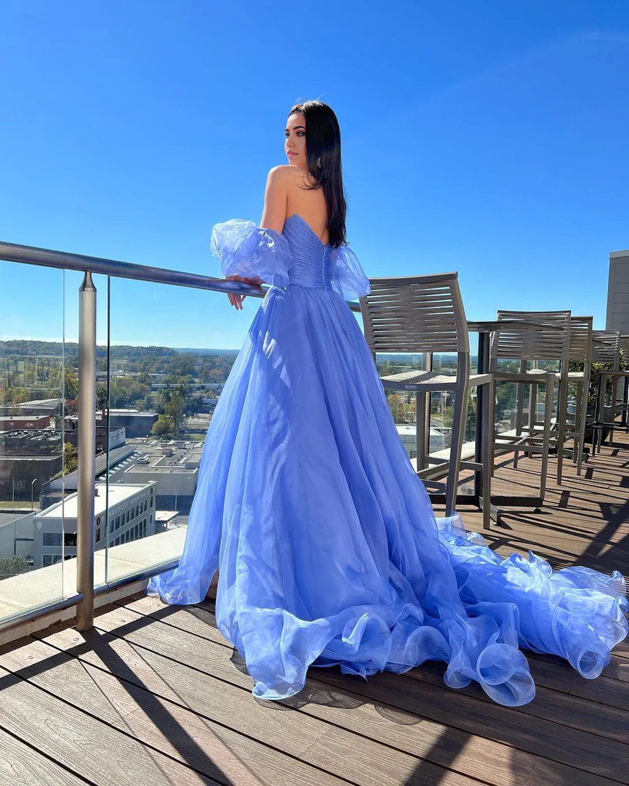 Full view of the charming blue A-line organza prom dress.