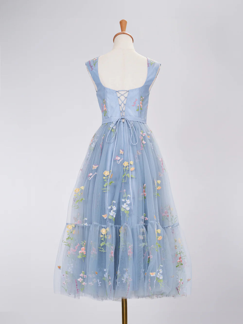 Close-up view of the delicate embroidery on the prom dress.