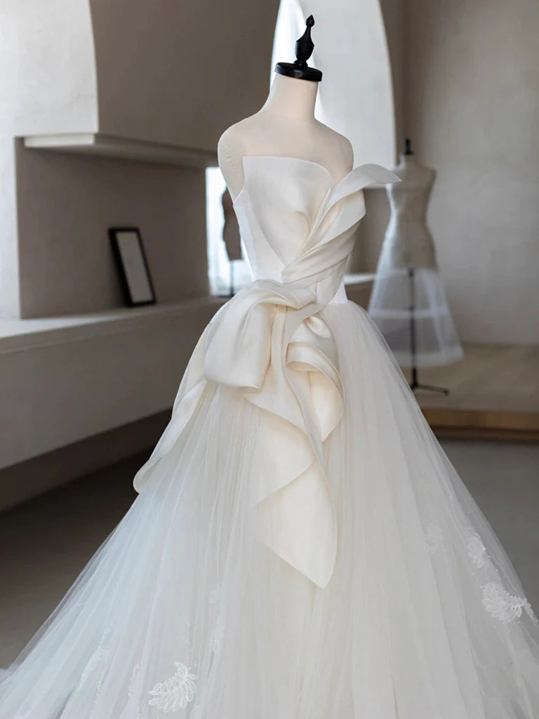 Back view of a long A-line prom dress with delicate lace details.