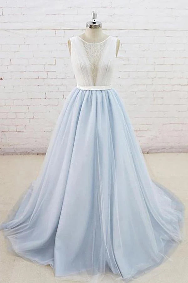 Elegant sleeveless tulle formal gown with sheer back and sweep train.