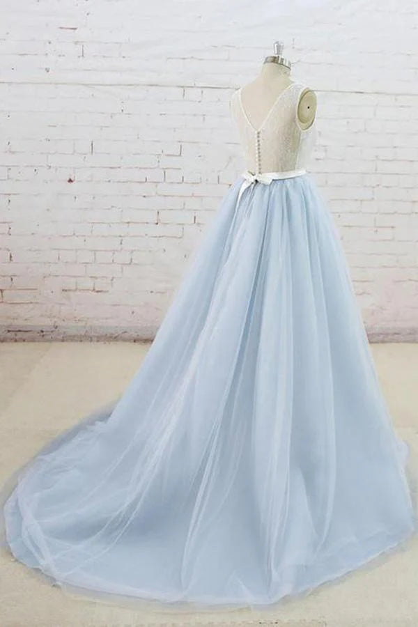 Back view of a formal tulle dress, showcasing the sheer back and sweep train.