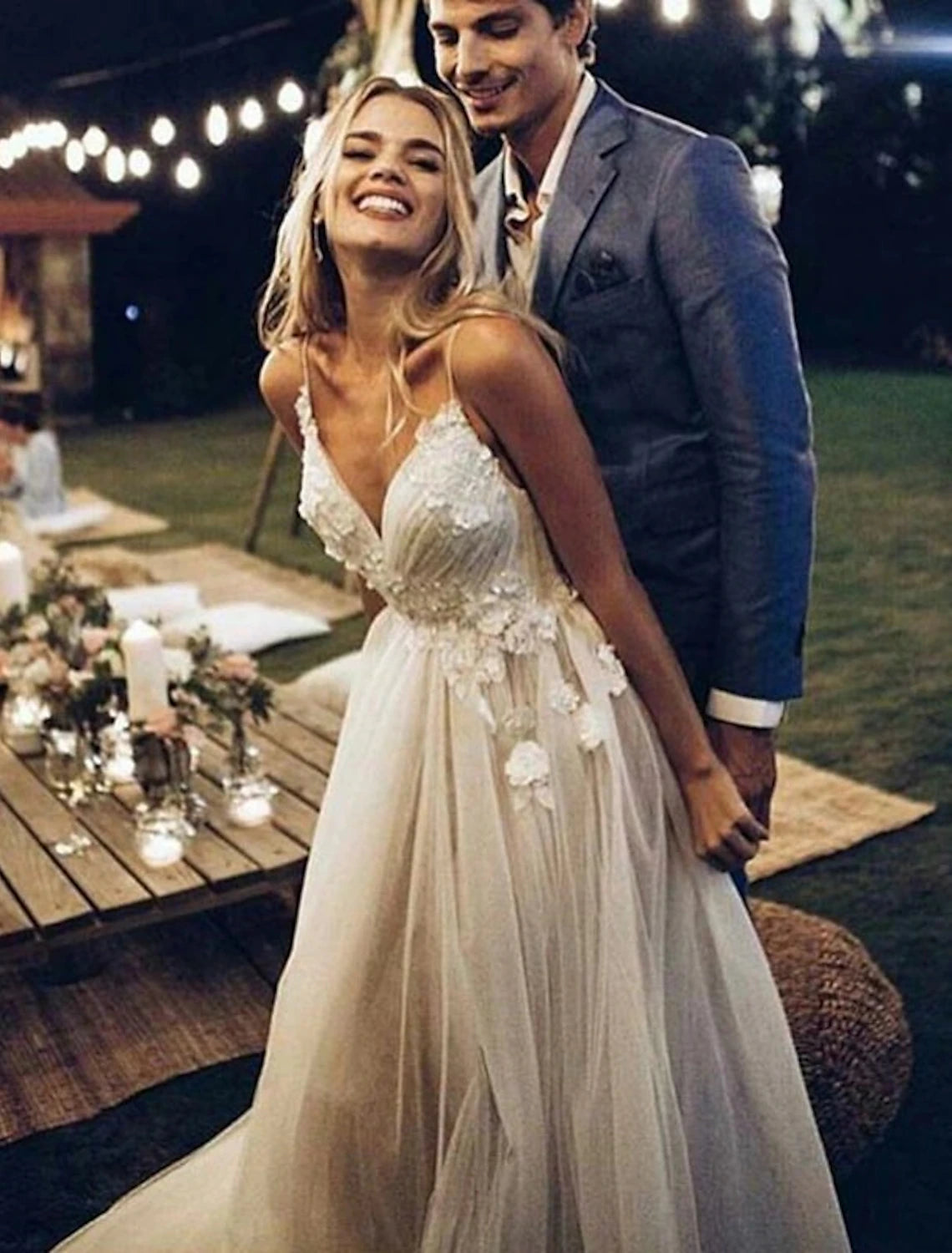 Elegant A-line lace wedding dress with sweetheart neckline and spaghetti straps.