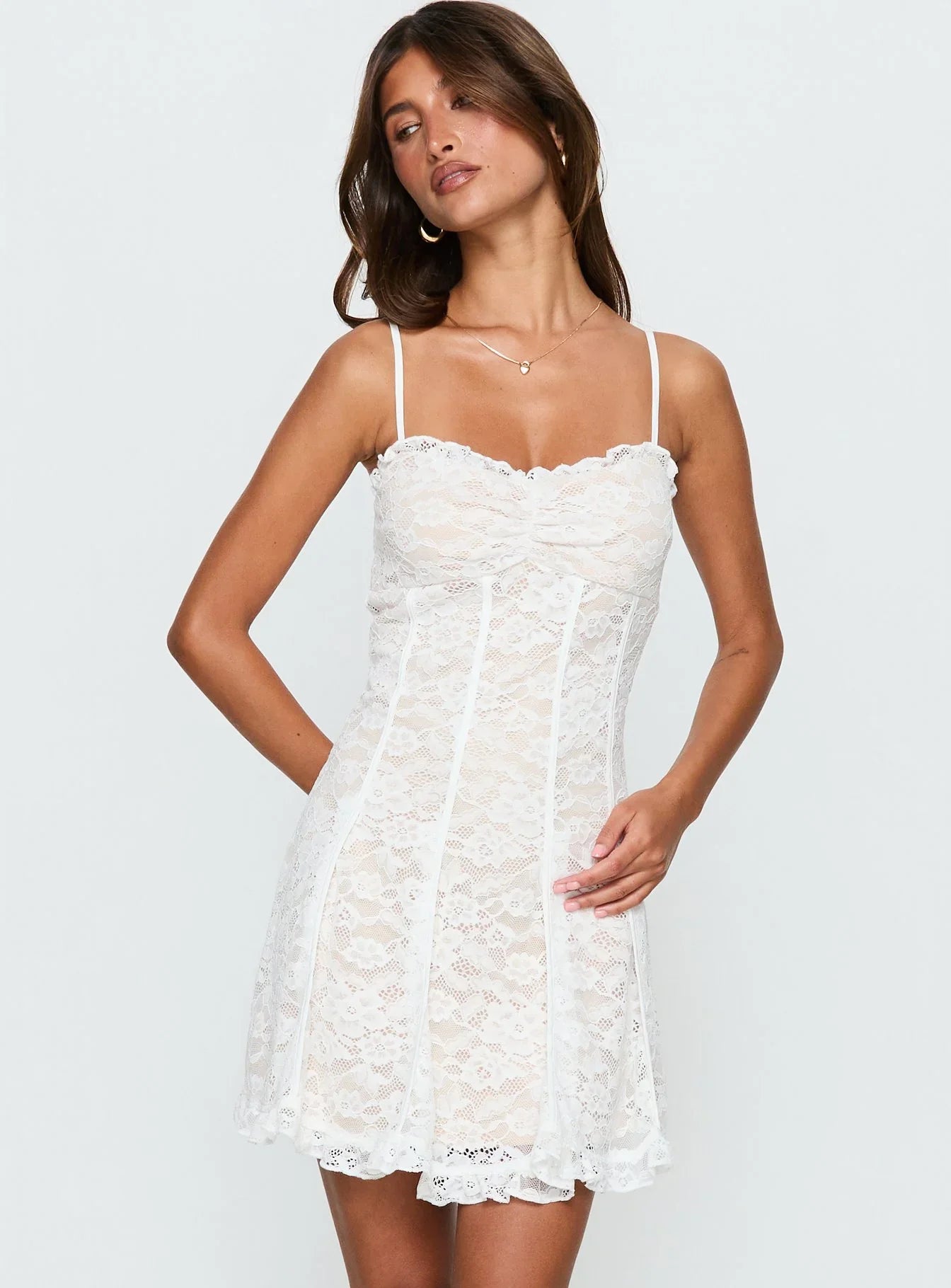 Side view of the white homecoming dress, showcasing its elegant silhouette.