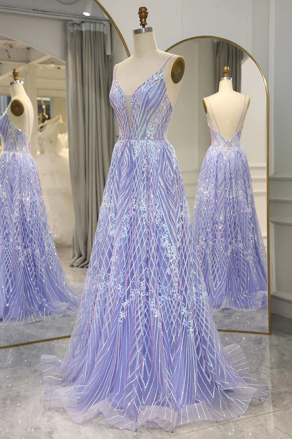 Elegant A-line prom dress with sweetheart neckline and spaghetti straps.