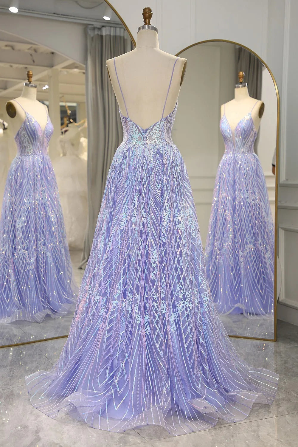 Back view of A-line prom dress showing open back design.