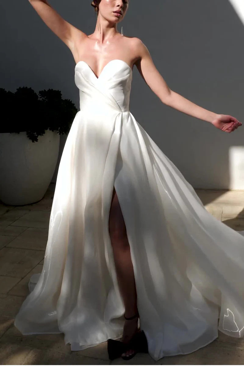 Elegant A-line wedding dress with sweetheart neckline and front split.